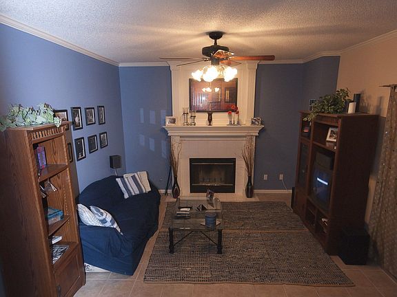 Relax in the Family Rm, with tile fireplace, sliding glass door to patio!