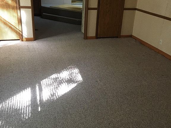 Master bedroom showing doorway to master bathroom and 2 closets.