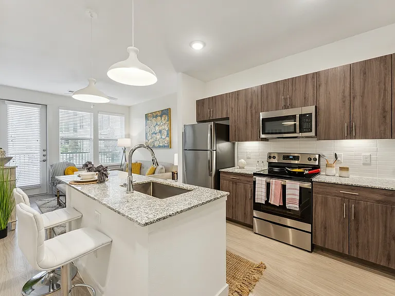 Enjoy cooking and entertaining around our spacious, modern kitchen islands at Latitude Apartments