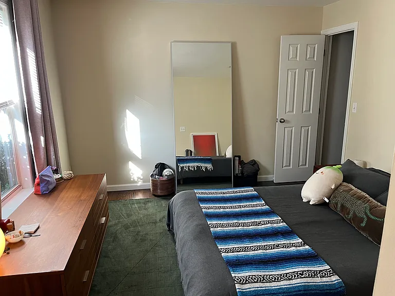 primary bedroom with both walk-in and sliding door closet