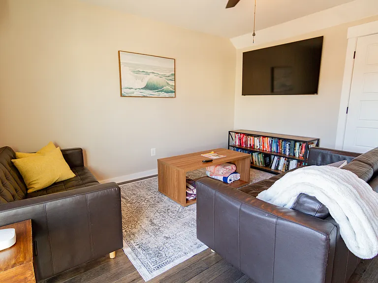 3rd floor living room with smart TV and walks out to a 3rd floor terrace