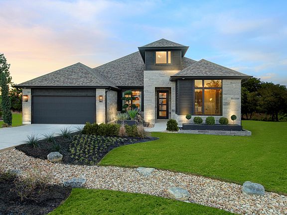 custom home with stone and stucco exterior