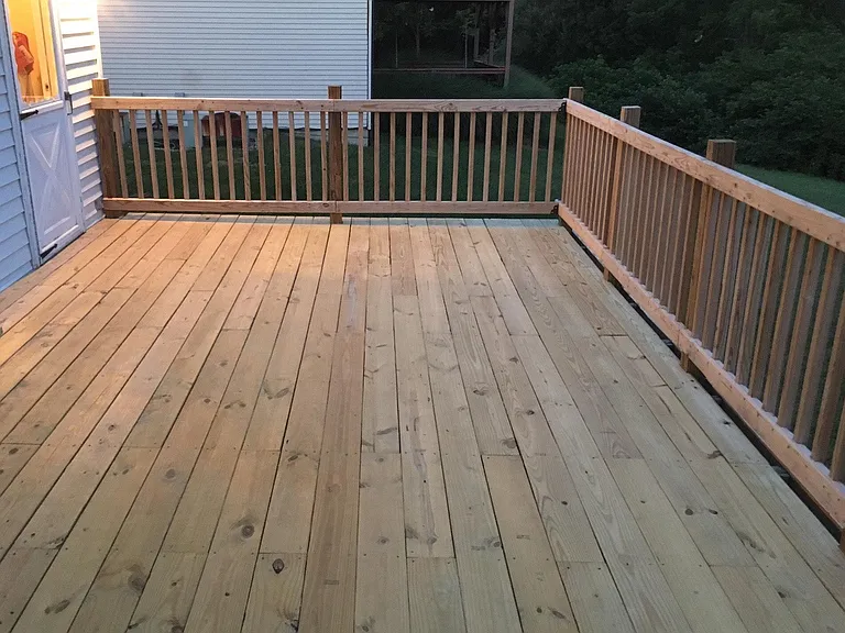 Large Deck with privacy fence, which separates the attached neighbor