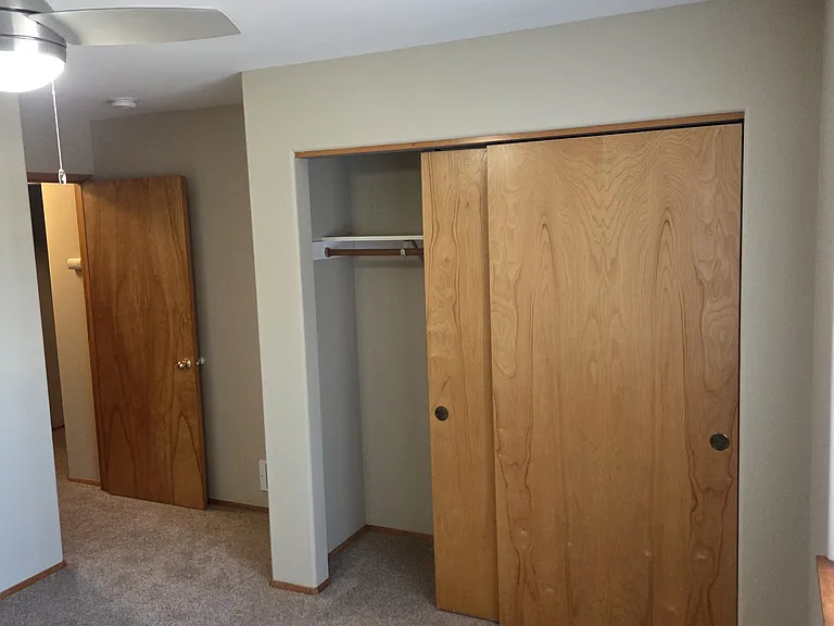 View of the guest bedroom closet and guest bedroom entrance.