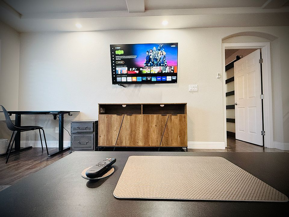 Stream your favorite shows w/ this mounted 55in SmartTV. Angle it to the desk or kitchen for your viewing pleasure.