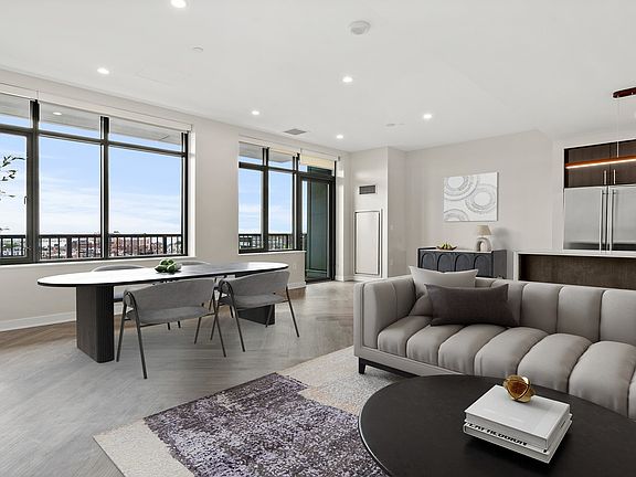 Penthouse kitchens feature quartz countertops and breakfast bars