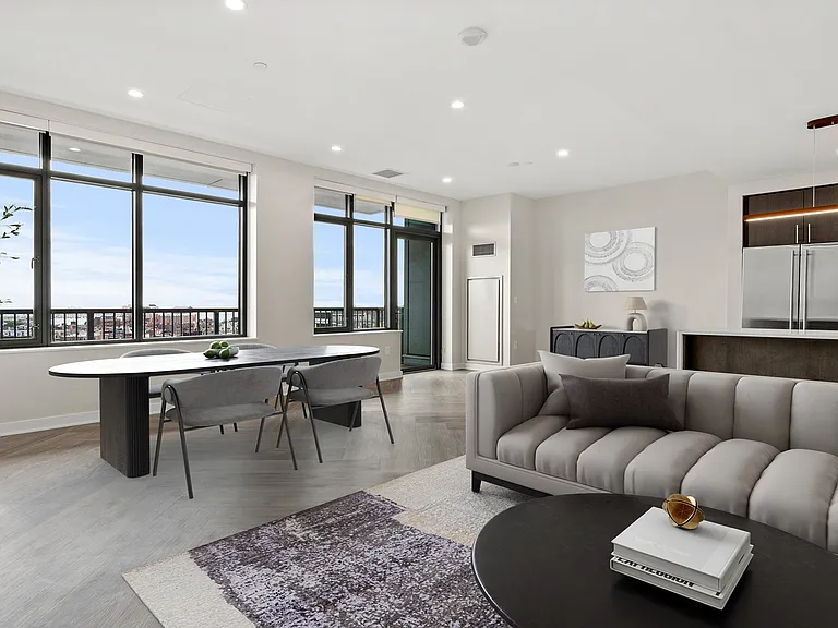 Penthouse kitchens feature quartz countertops and breakfast bars