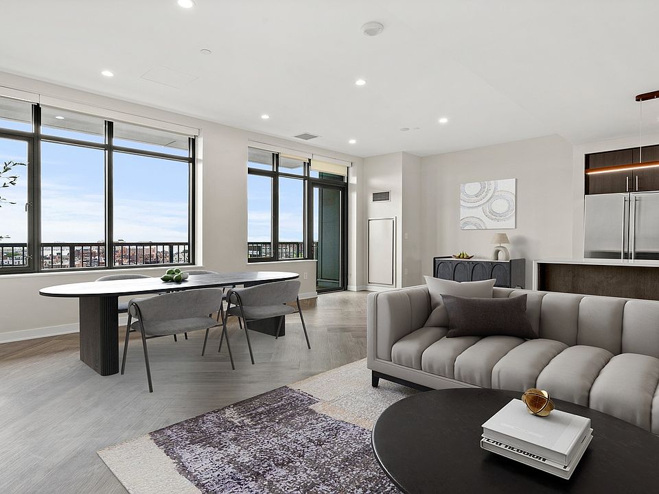 Penthouse kitchens feature quartz countertops and breakfast bars
