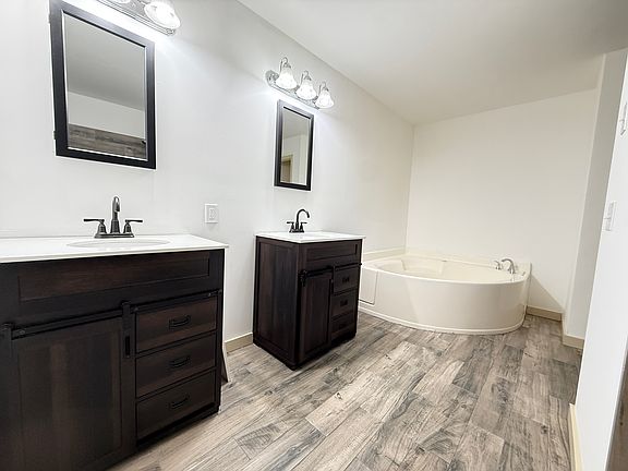 Master bathroom includes a jacuzzi tub and shower
