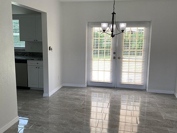 Dining room with French doors leading to covered porch