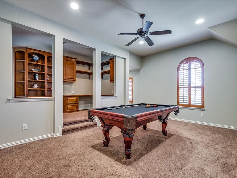 Versatile bonus room featuring a pool table and plush carpeting