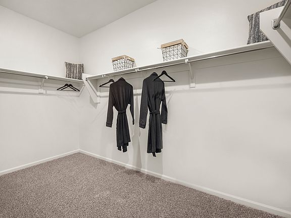 There apos s plenty of room for your wardrobe in this walk-in primary closet.
