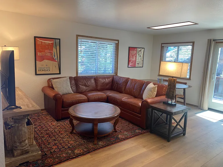 Living area with access to sunny rear deck.