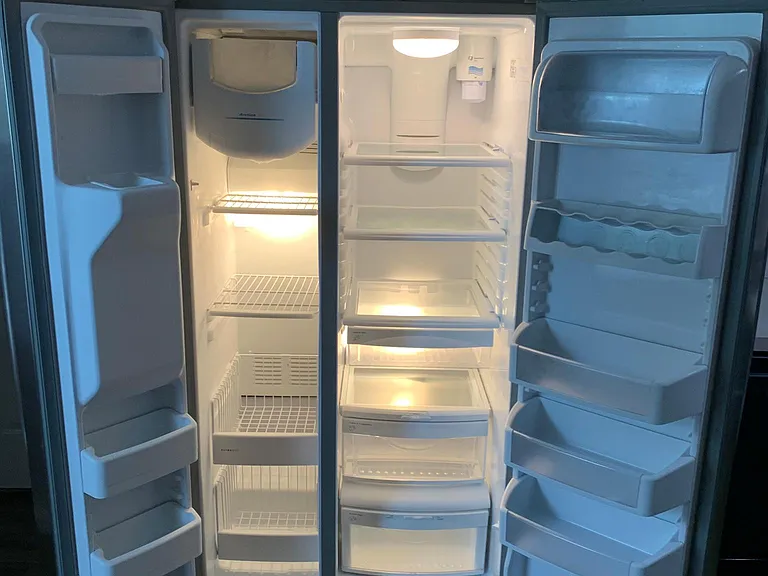 Large fridge freezer with ice-maker/water filter.