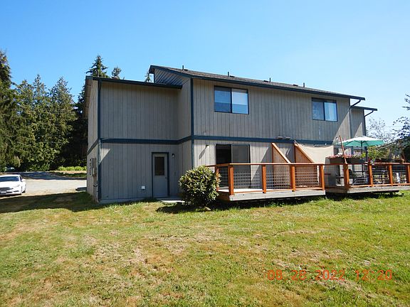 Rear deck, unit A is on the left. Deck is right off kitchen with view of the slough
