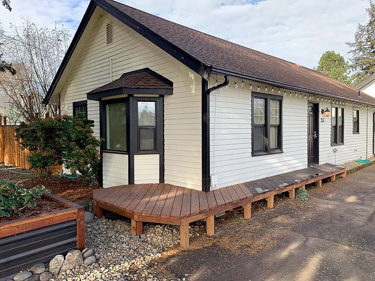 Follow the wrap around deck to the front door with coded entry.
