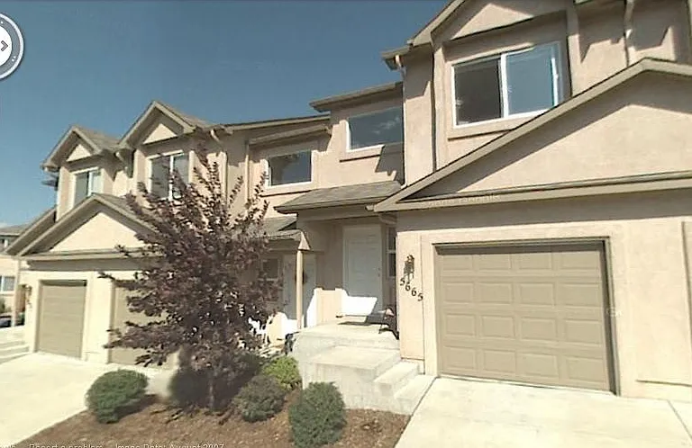 Closeup of front of the building, all landscaping paid.