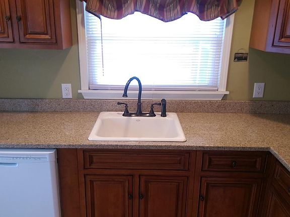 Kitchen w/ granite overlooking yard