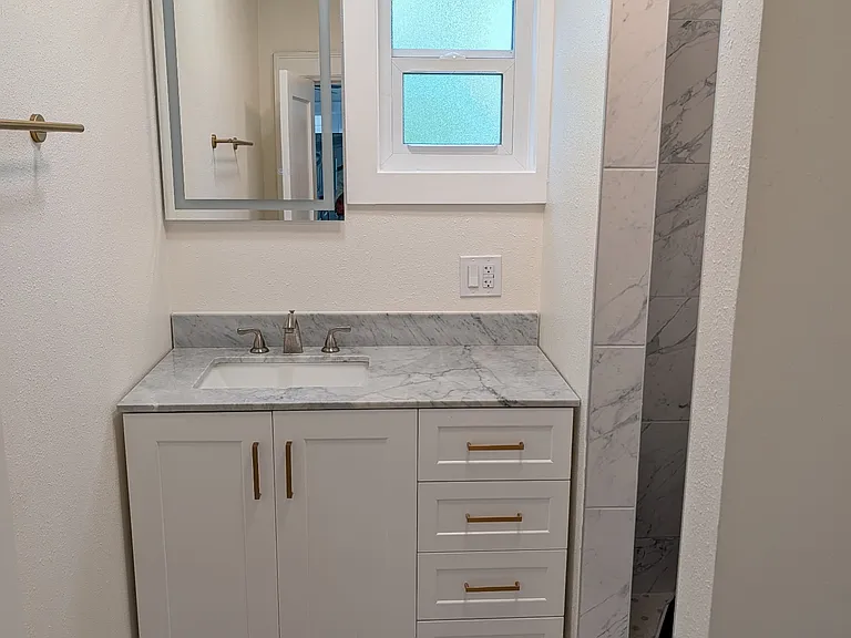 Large vanity with plenty of counter space and storage.