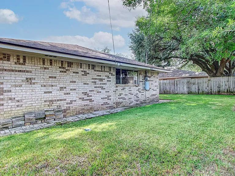 back of home fenced yard