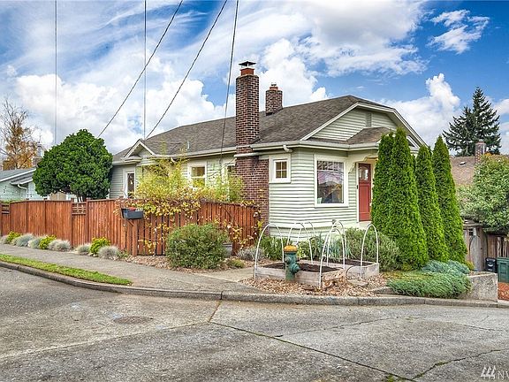 This meticulous Phinney Ave home is close to shops/eateries, zoo, parks & only 4 blocks from the lake. Perfectly located on a corner lot & don't forget the views of the mountains! 