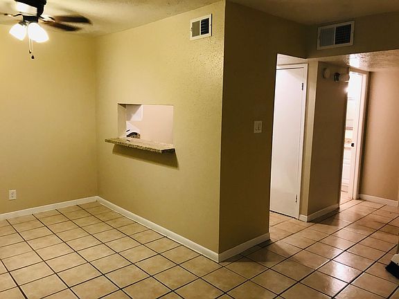 Cute breakfast/dining area with granite bar that opens up to the kitchen.