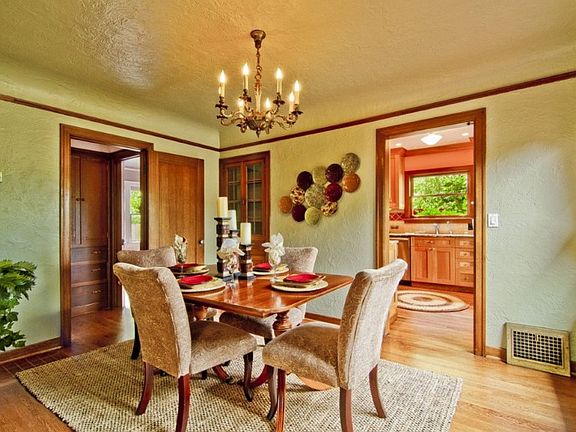 Formal dining room, mahogany trim, leaded glass hutch. Notice the picture rails throughout the home!