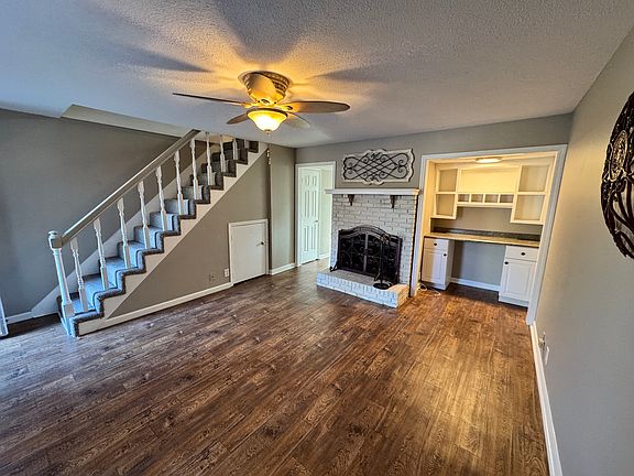 Cozy up to your Wood Burning Fireplace while doing a little office work.