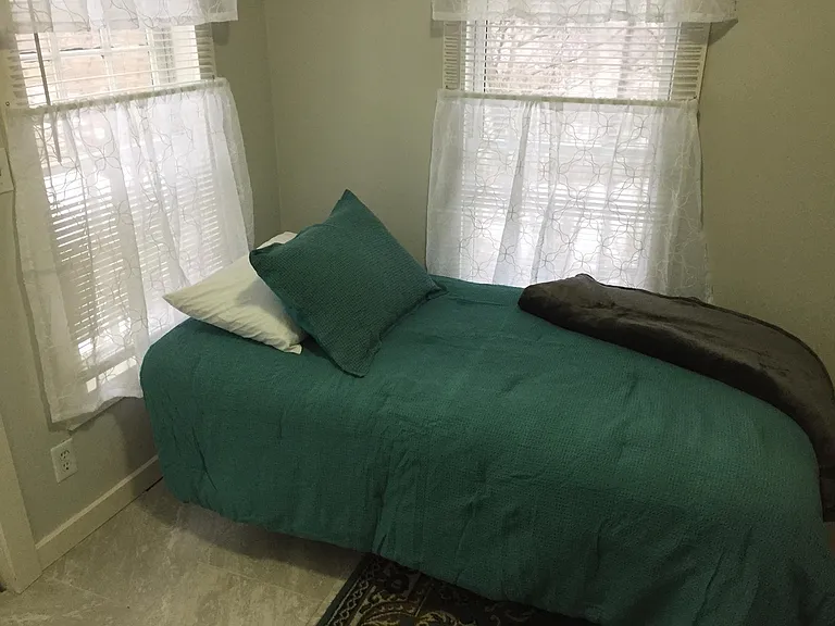 Backroom bedroom and utility area.
Washer/dryer with backdoor.