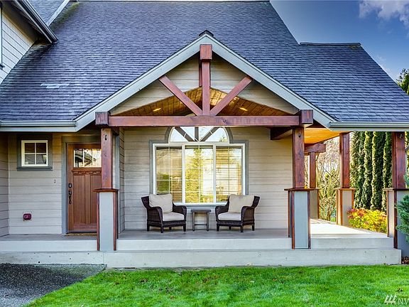 Beautiful covered front porch that wraps around to the back of the house.