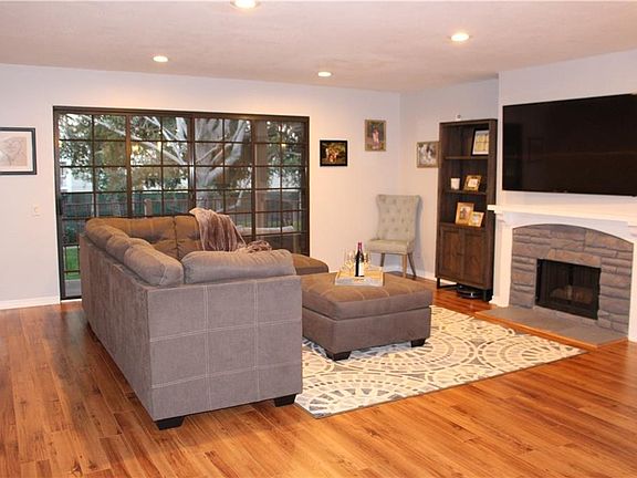 Spacious Family Room with Fireplace, Opens up to a Balcony w