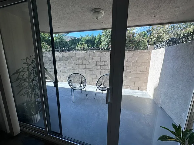 Large patio for a seating area, BBQ, and more! It spans the entire length of the condo.