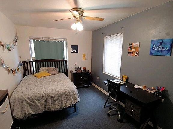 Bedroom three features two large windows and... a walk-in closet.