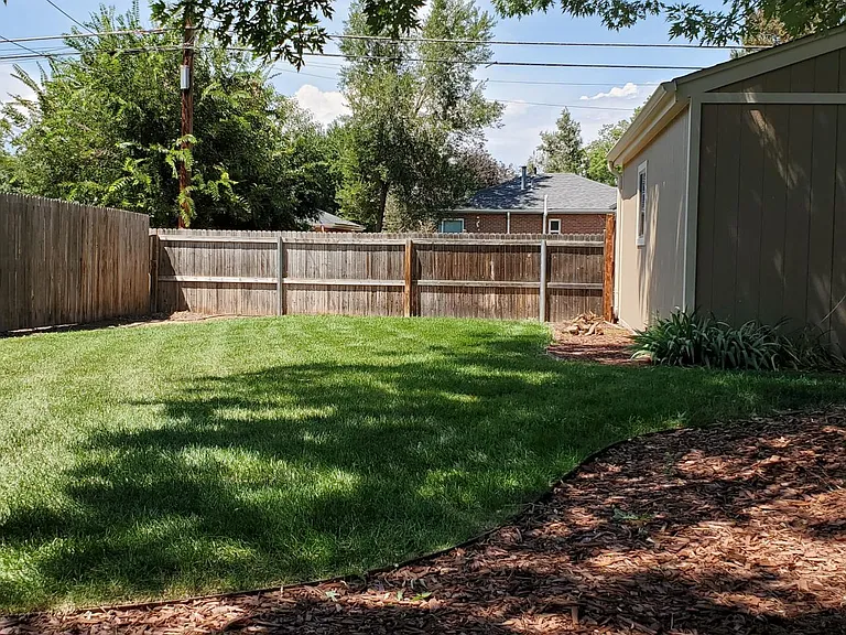 Private fenced backyard with 2 car garage