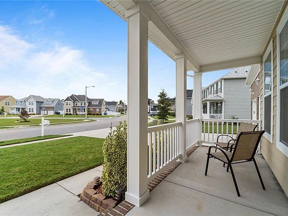 Enjoying sitting on the front porch and watching the  kids play
