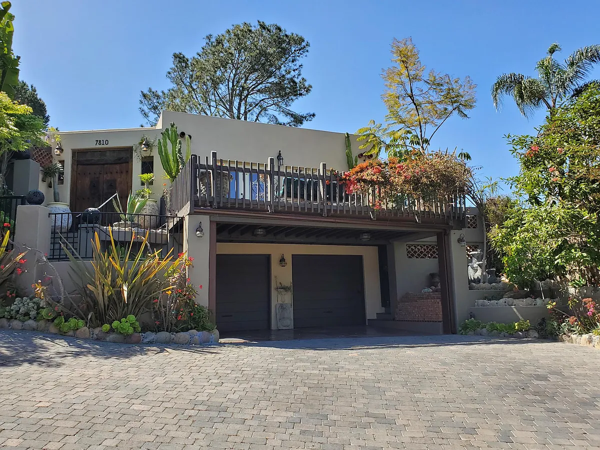 Front of house with covered parking. Garage not included with rental. - 7810 Roseland Dr