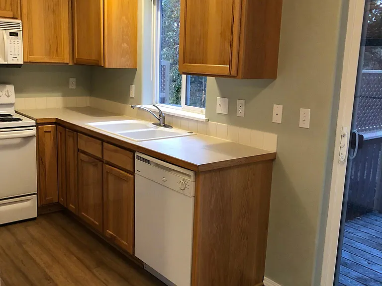 Fully equipped kitchen with range, fridge, dishwasher and microwave. Great wooded view from kitchen window.