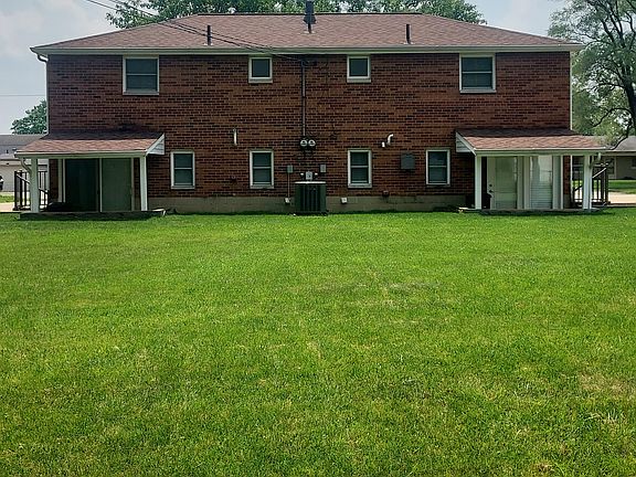 Rear view of the 4924 & 4926 Beacon Hill Rd townhouse and its deep backyard.