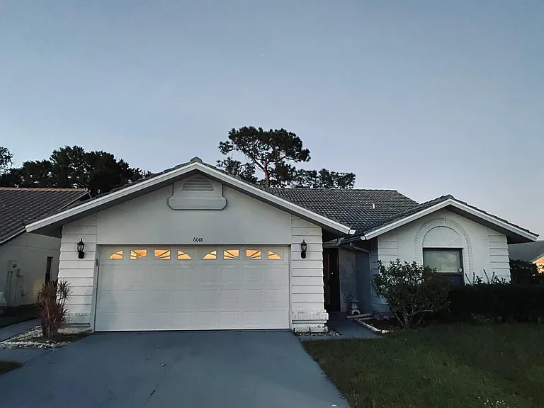exterior freshly painted with neutral color. 2-car garage