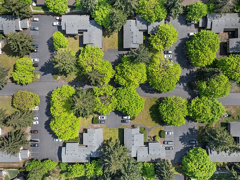Drone footage providing an aerial view of the apartment community and the surrounding greenery.