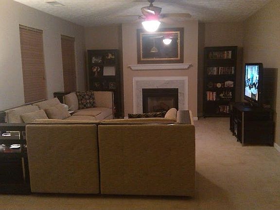 Spacious living room with marble fireplace
