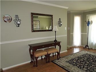 Living Room with chair rail and recessed lighting
