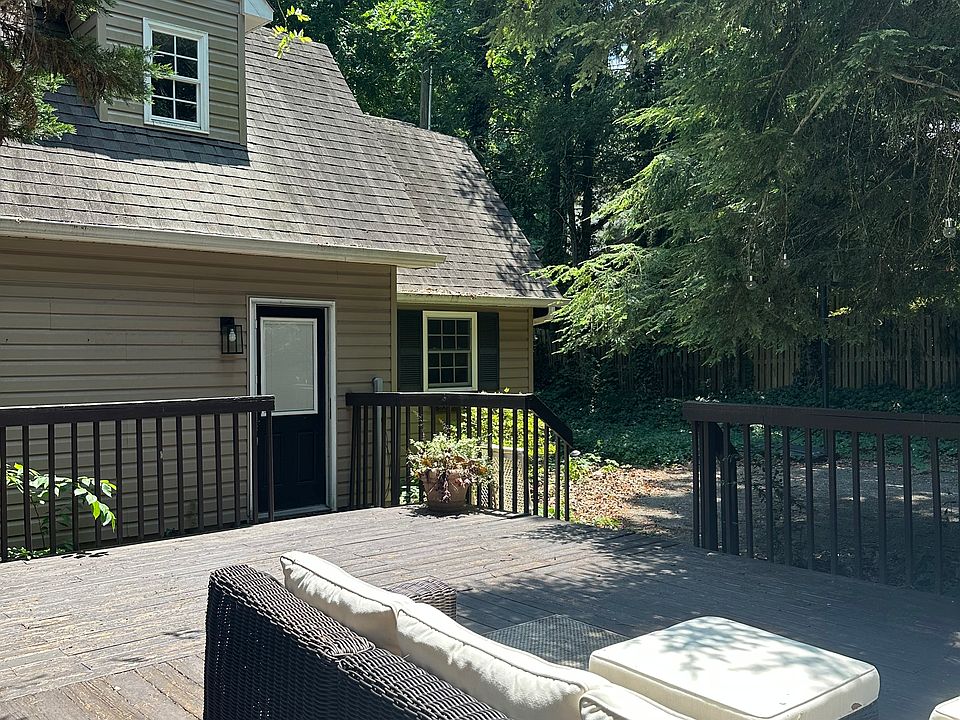 Large back deck connecting main home and guest house
