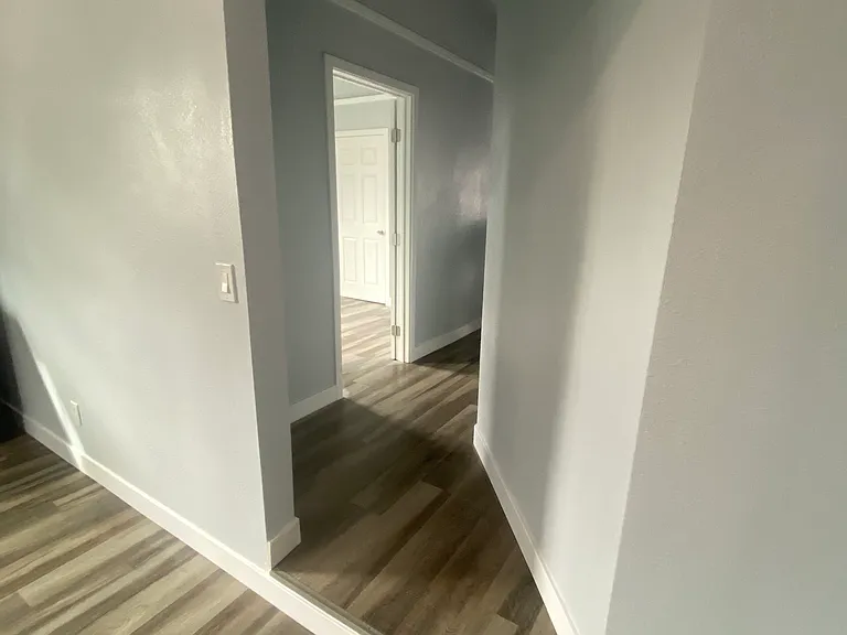 Walkway from Kitchen to Living Areas, Bedroom 2 is first to the left