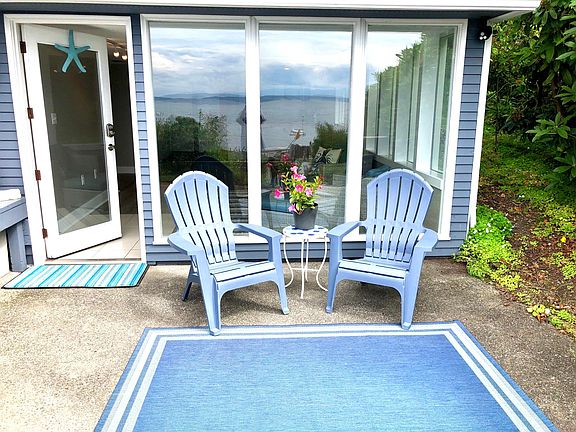 Private Patio steps from the larger shared patio and sandy beach