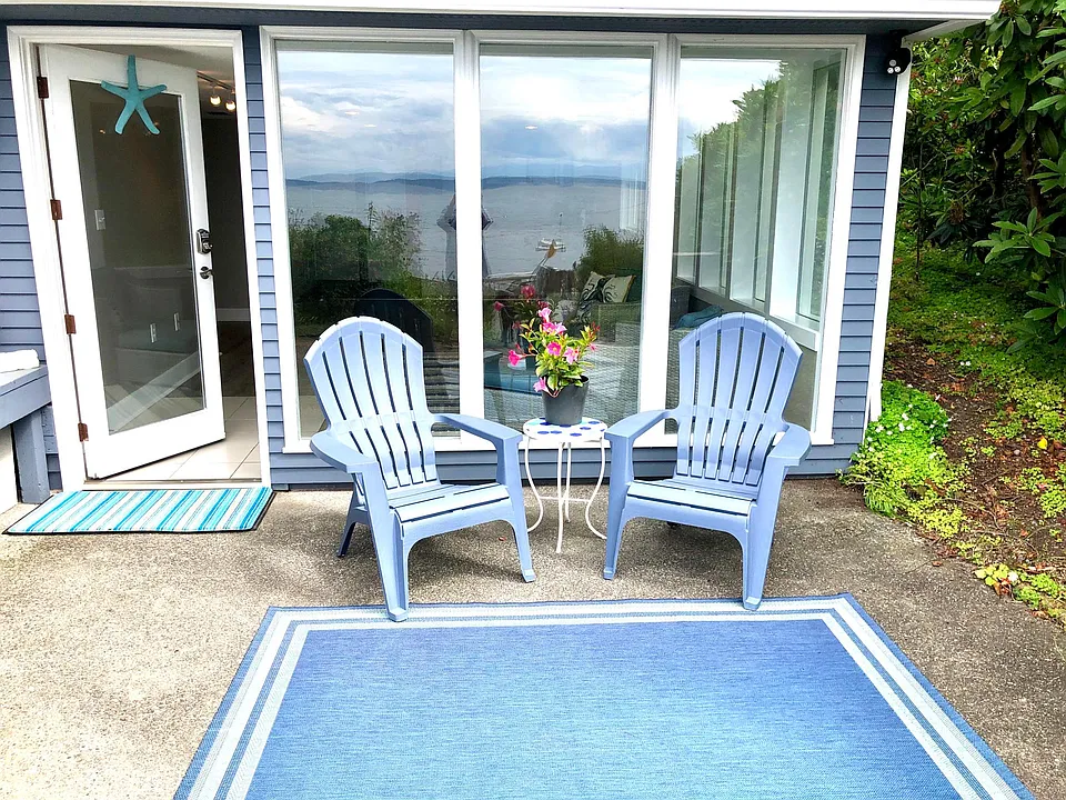 Private Patio steps from the larger shared patio and sandy beach