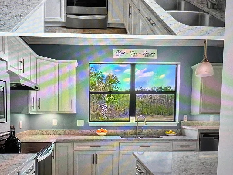 Fully stocked kitchen with water and preserve views. Stainless appliances