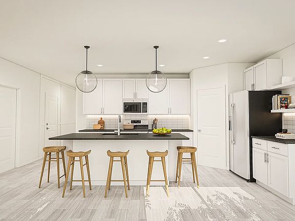 Kitchen with floating shelves and corner pantry