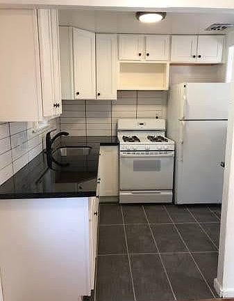 Kitchen with granite countertops.