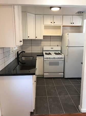 Kitchen with granite countertops.